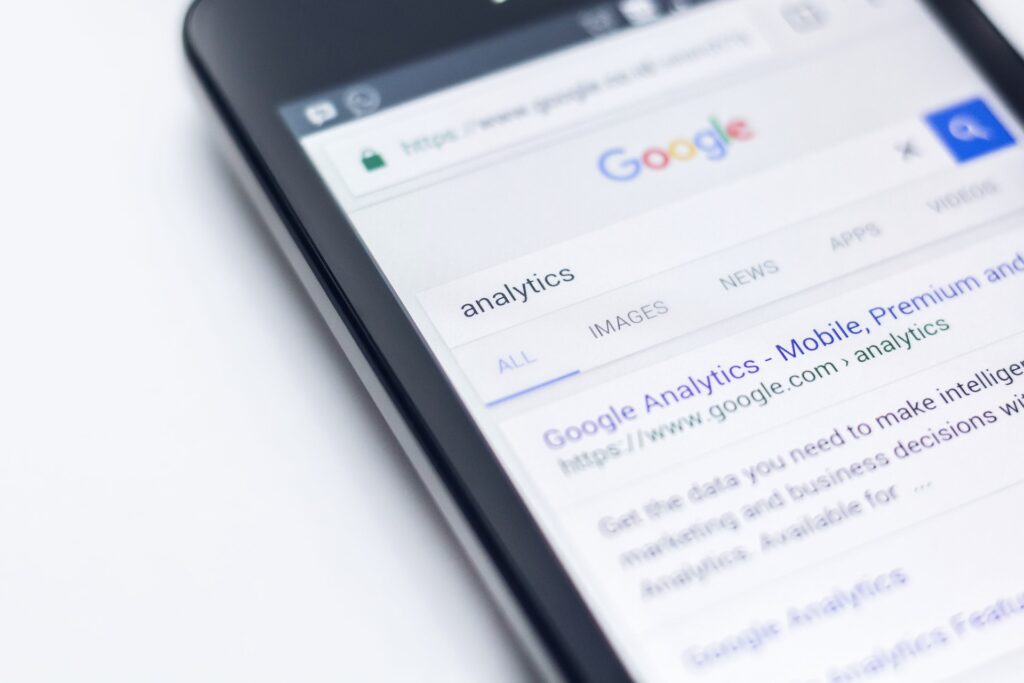 Looking up analytics on a smartphone to find and download Google Analytics