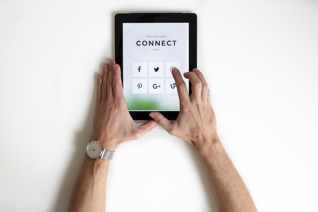 A person accessing the social media folder on an iPad.