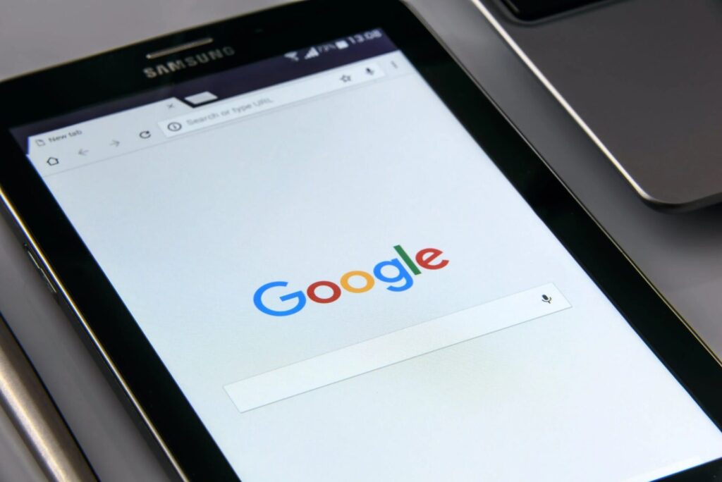 A black tablet that displays the Google search engine page.