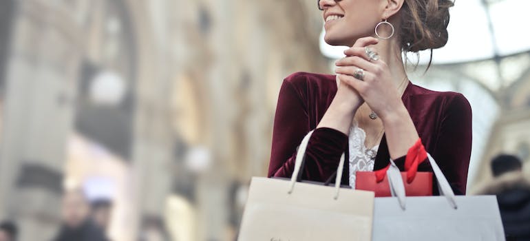 a woman with shopping bags