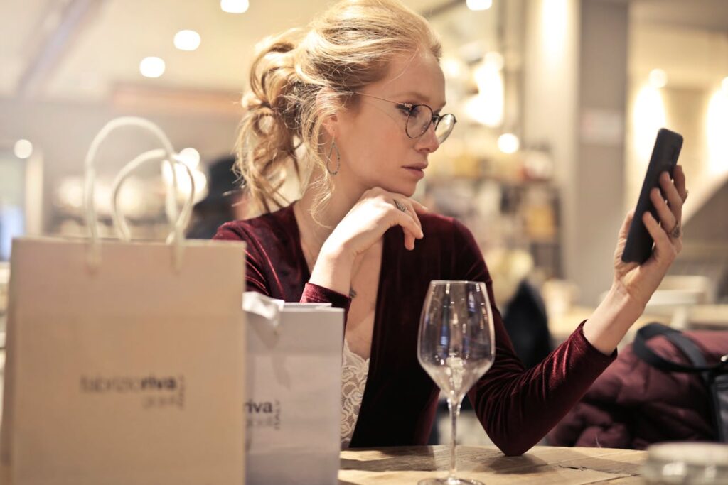Woman confusedly looking at her phone