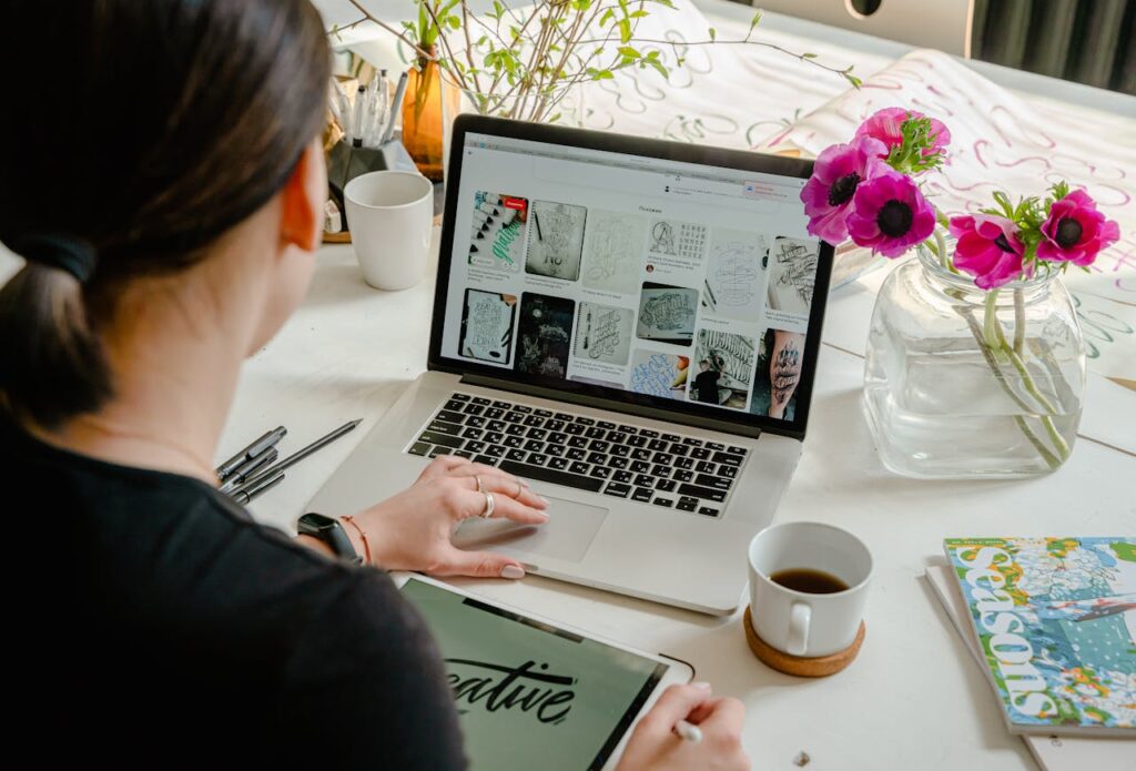 Woman looking at images on her laptop