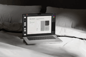 Affinity Designer laptop mockup displaying the editable brand presentation template open on screen.