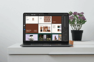 Adobe Illustrator laptop mockup showcasing the brand presentation template in use by a designer.