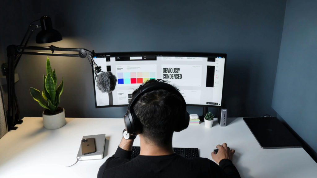 Designer reviewing a services and pricing guide at a work desk.