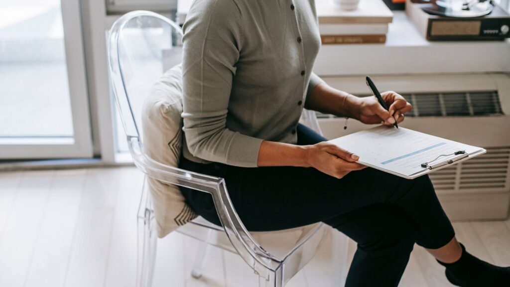 Brand strategy questionnaire laid out next to a laptop and notebook