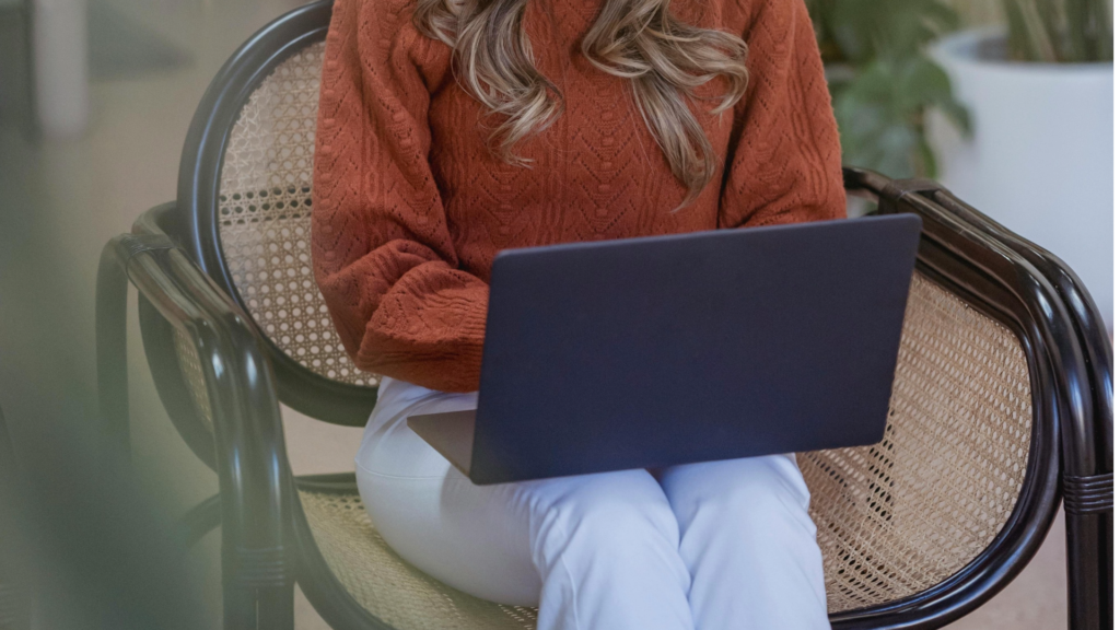 Freelance designer reviewing a branding proposal document on a laptop