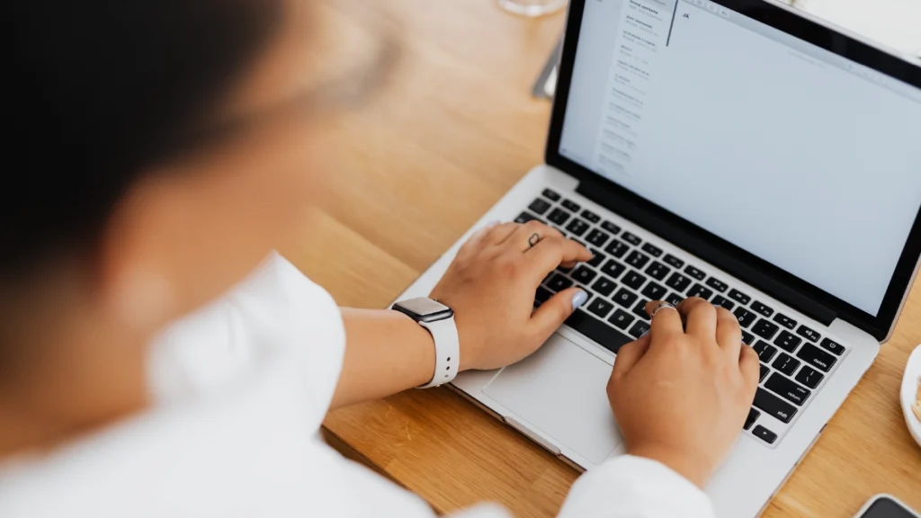 brand designer drafting an email to raise your prices with existing clients